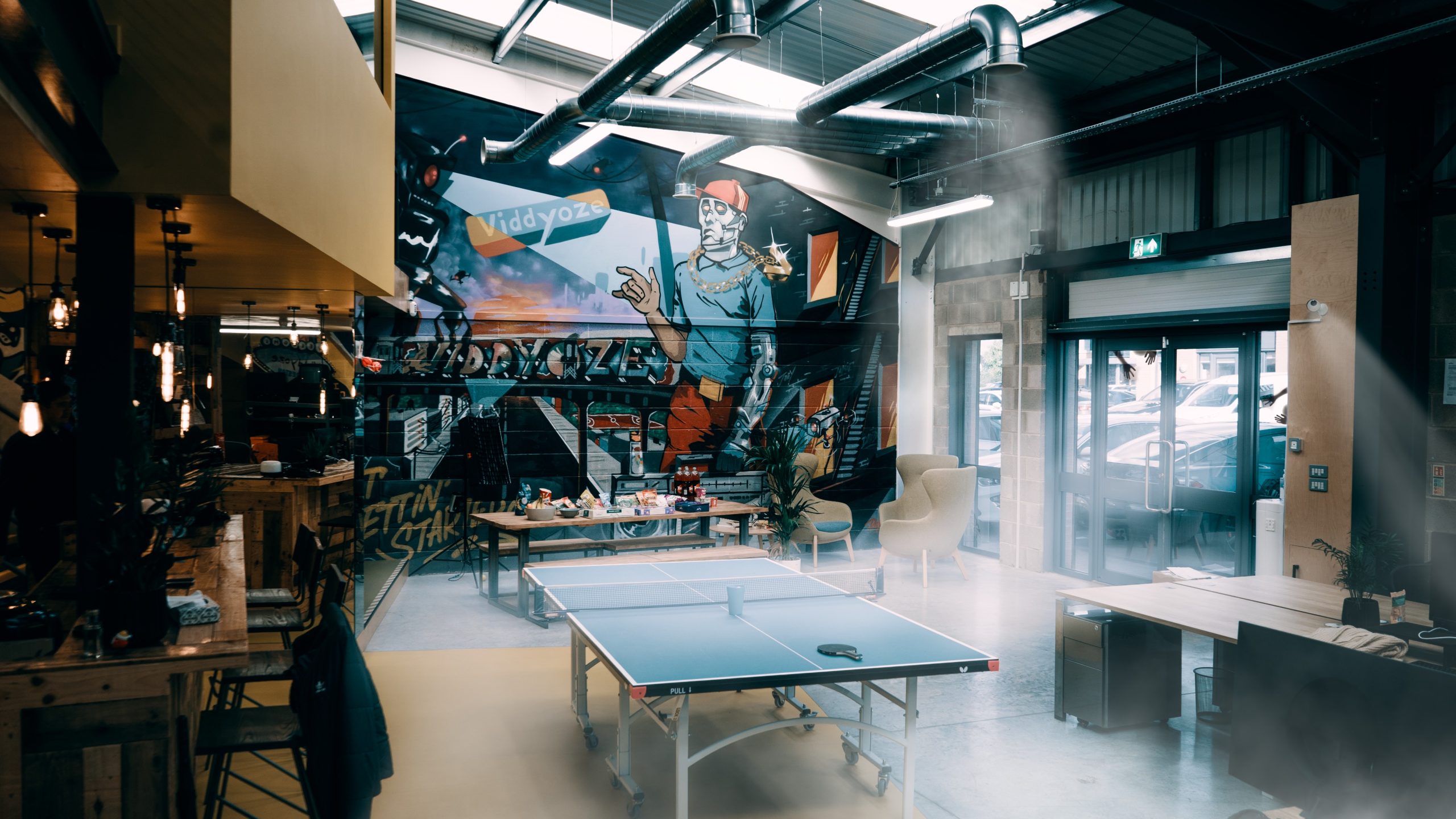 A shot of the office area including ping pong table and smokey Halloween effects over the image – used to support an article about creating video content for Halloween.